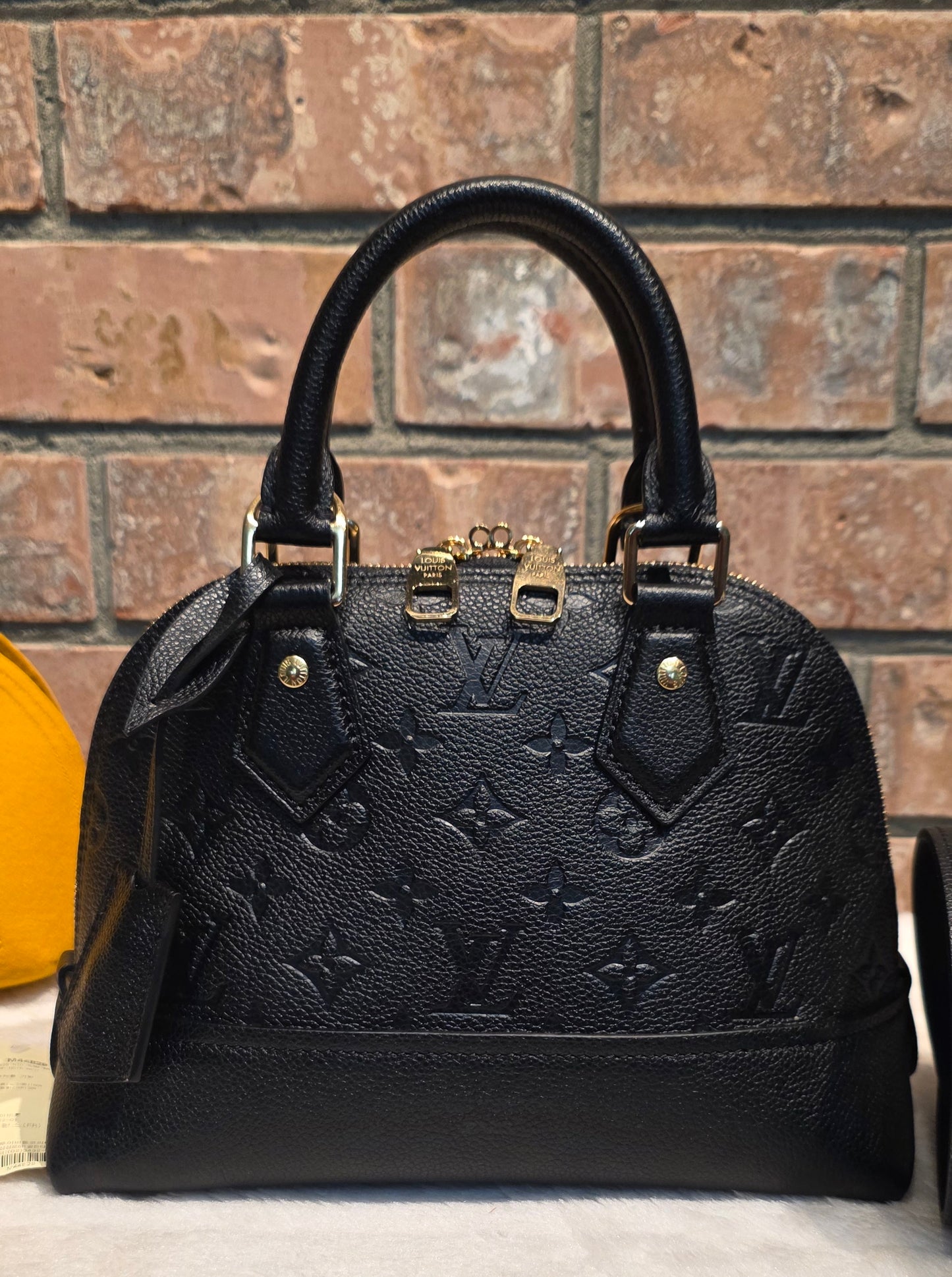 Authentic Louis Vuitton Neo Alma BB Empreinte Noir
