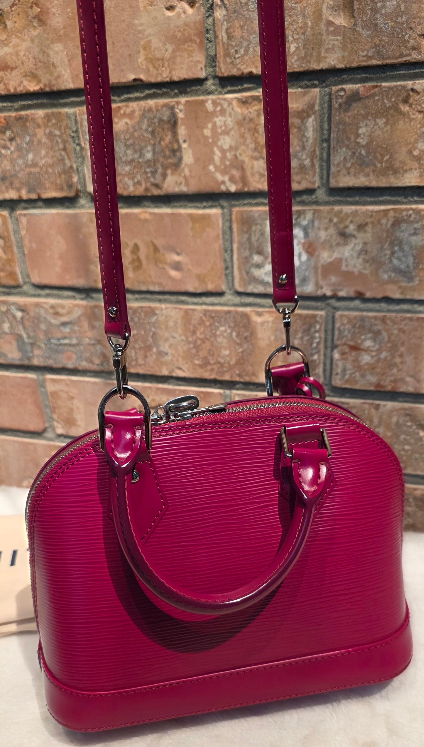 Authentic Louis Vuitton Alma BB Epi Leather in Fuchsia