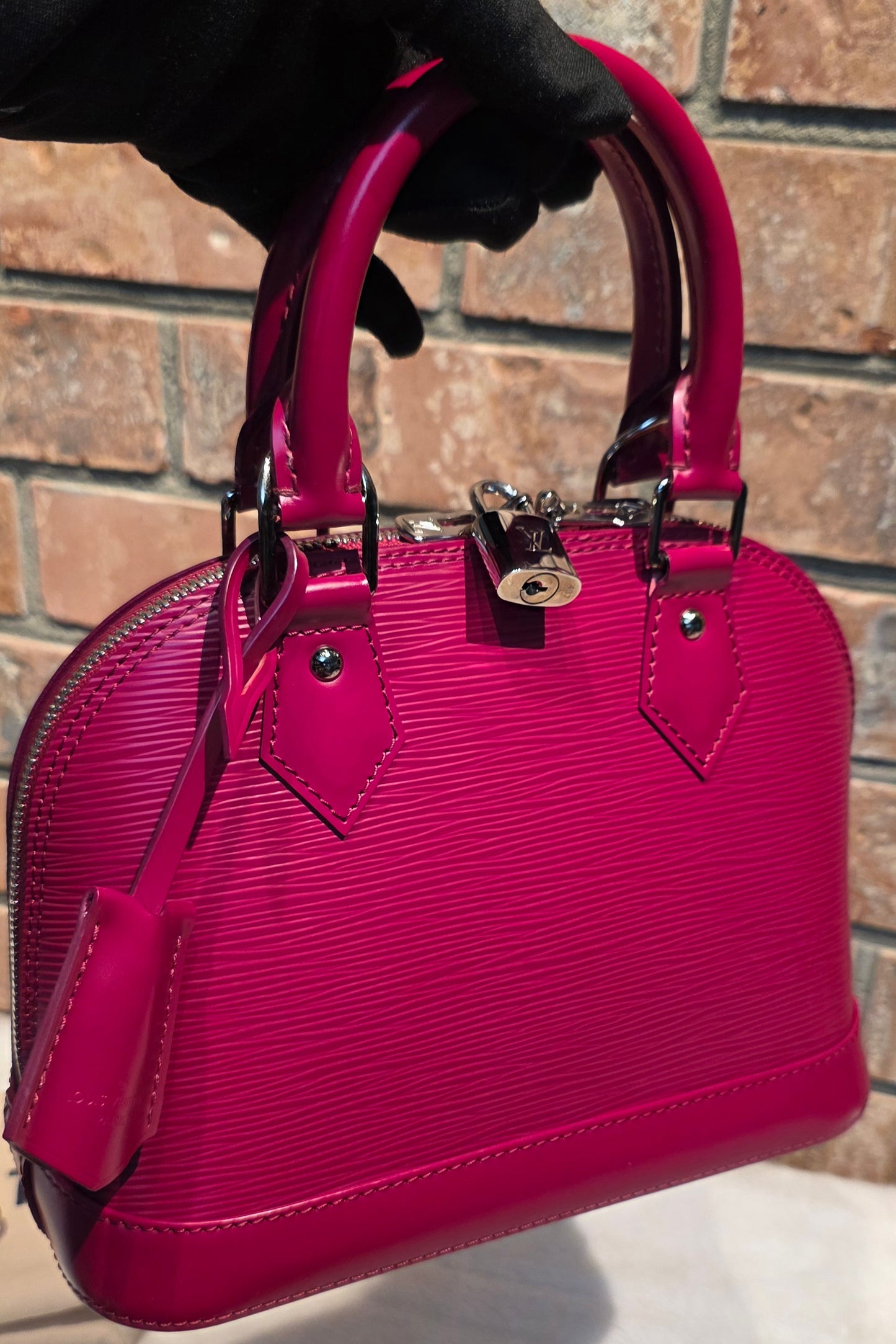 Authentic Louis Vuitton Alma BB Epi Leather in Fuchsia