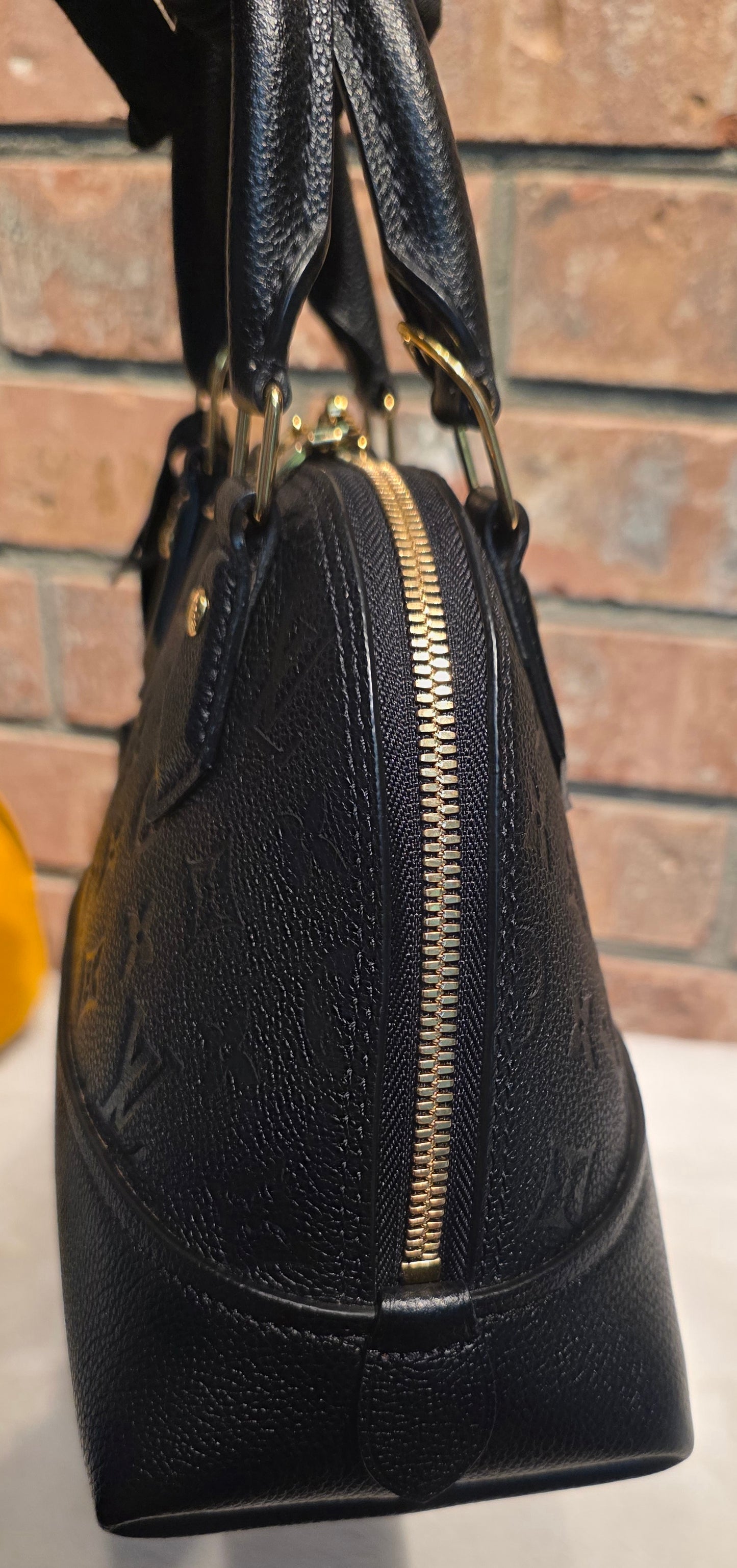 Authentic Louis Vuitton Neo Alma BB Empreinte Noir
