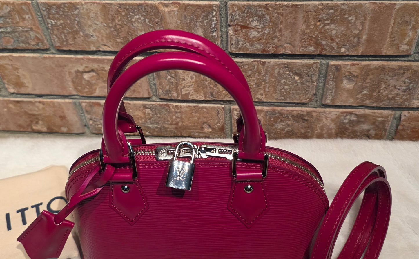 Authentic Louis Vuitton Alma BB Epi Leather in Fuchsia