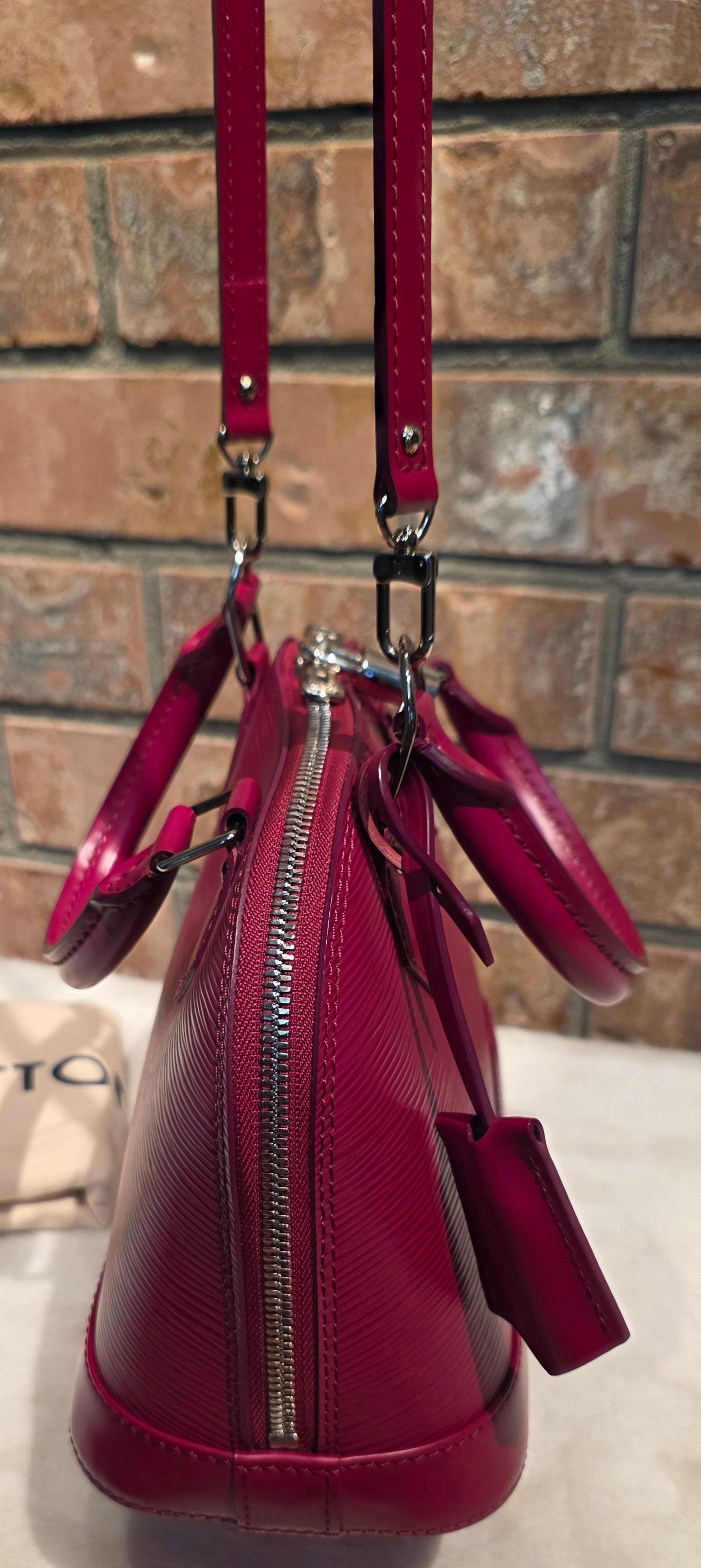 Authentic Louis Vuitton Alma BB Epi Leather in Fuchsia