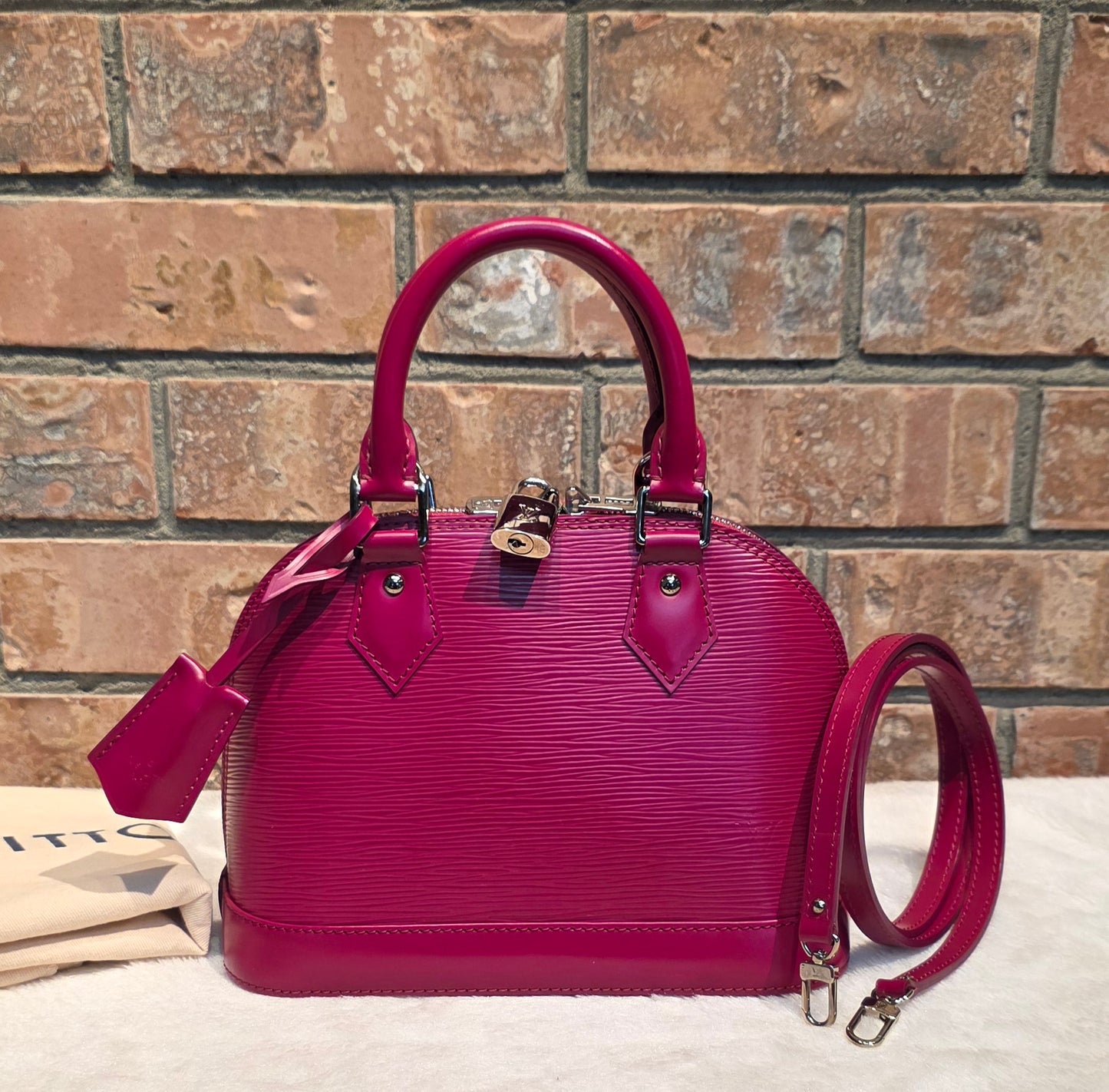 Authentic Louis Vuitton Alma BB Epi Leather in Fuchsia