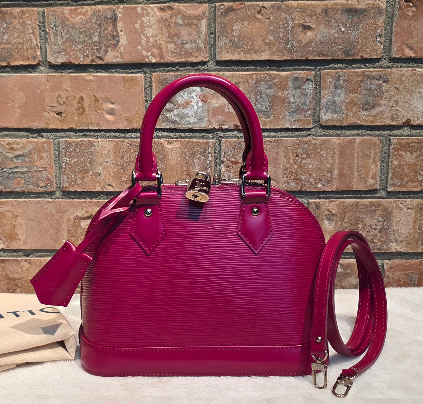 Authentic Louis Vuitton Alma BB Epi Leather in Fuchsia
