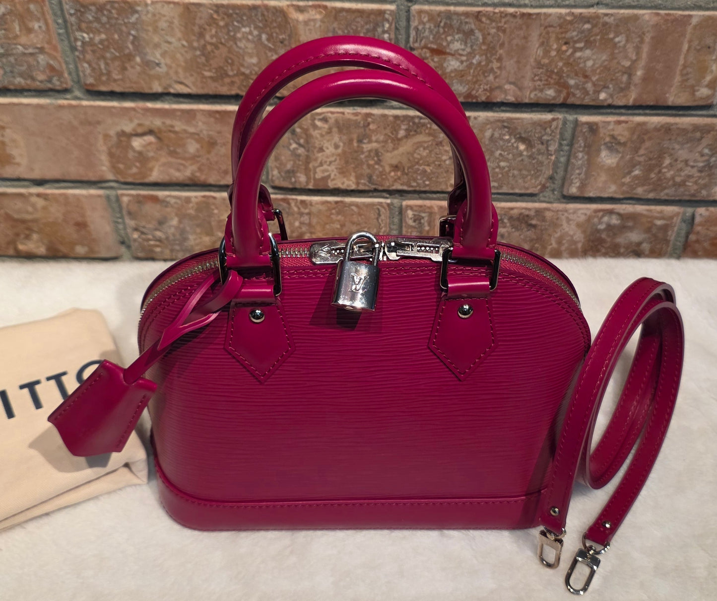 Authentic Louis Vuitton Alma BB Epi Leather in Fuchsia