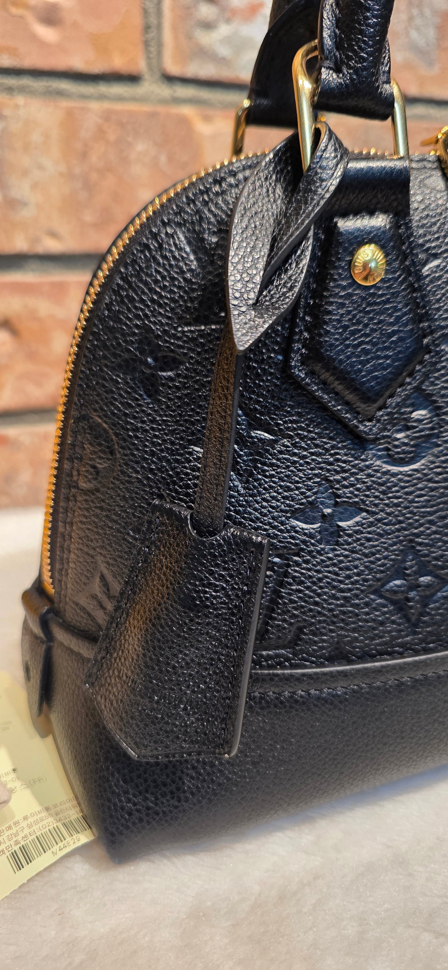 Authentic Louis Vuitton Neo Alma BB Empreinte Noir