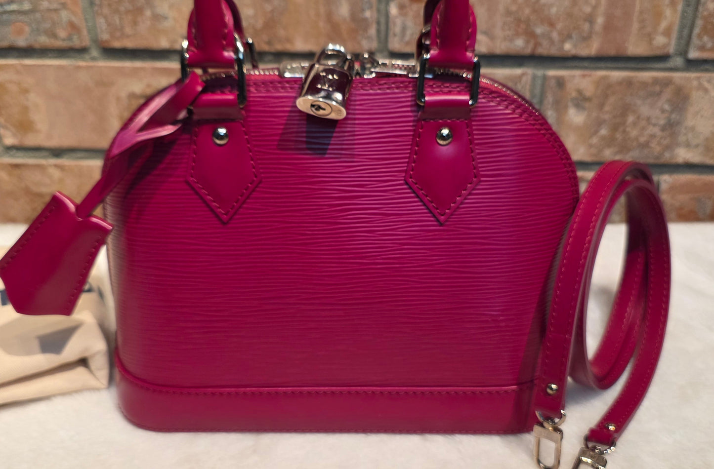 Authentic Louis Vuitton Alma BB Epi Leather in Fuchsia