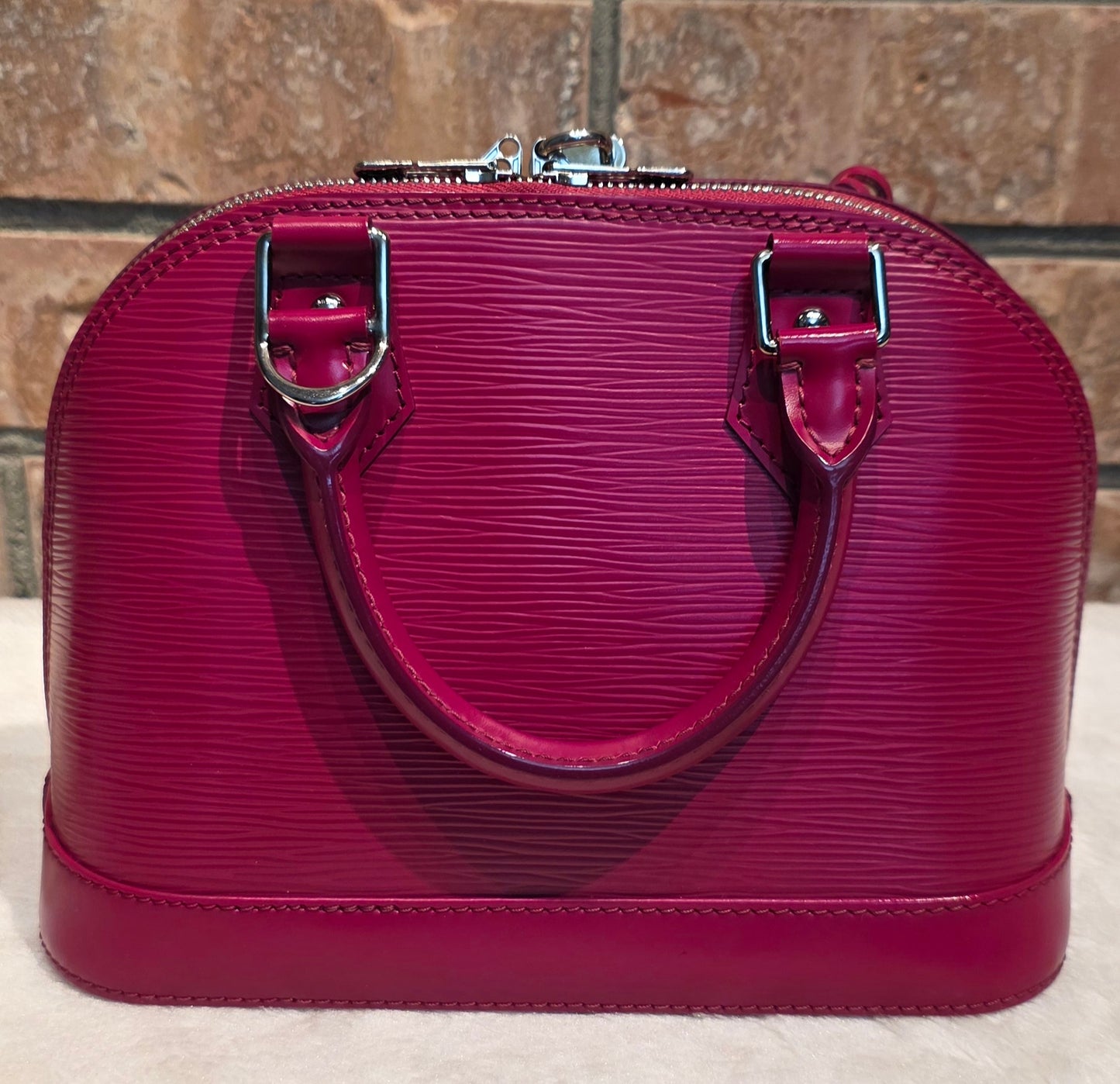 Authentic Louis Vuitton Alma BB Epi Leather in Fuchsia
