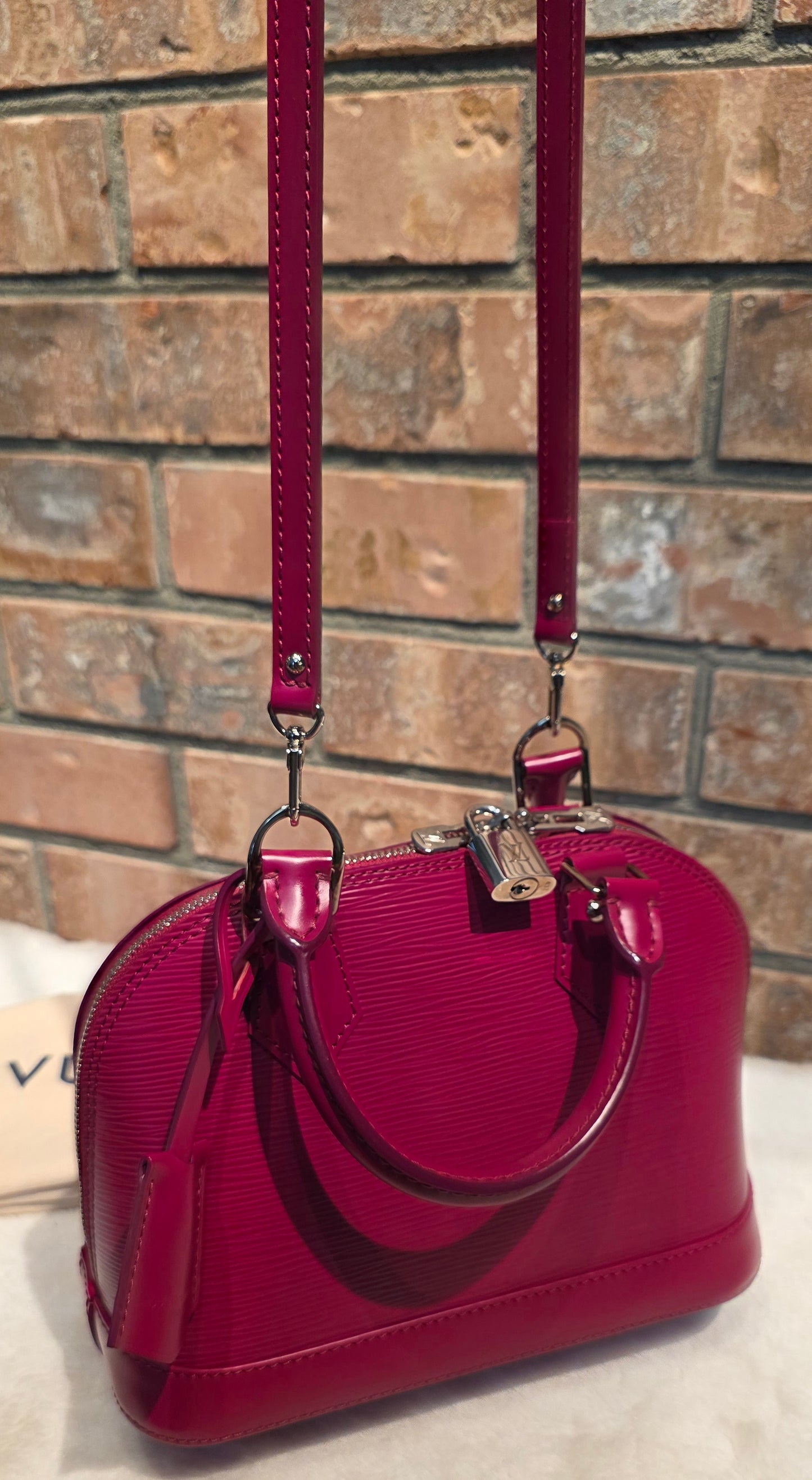 Authentic Louis Vuitton Alma BB Epi Leather in Fuchsia