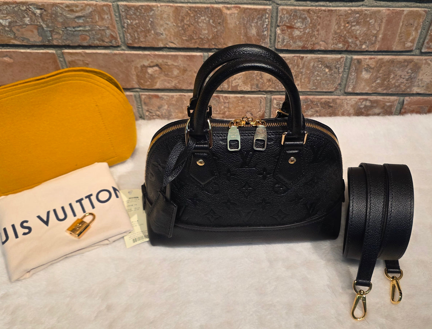 Authentic Louis Vuitton Neo Alma BB Empreinte Noir