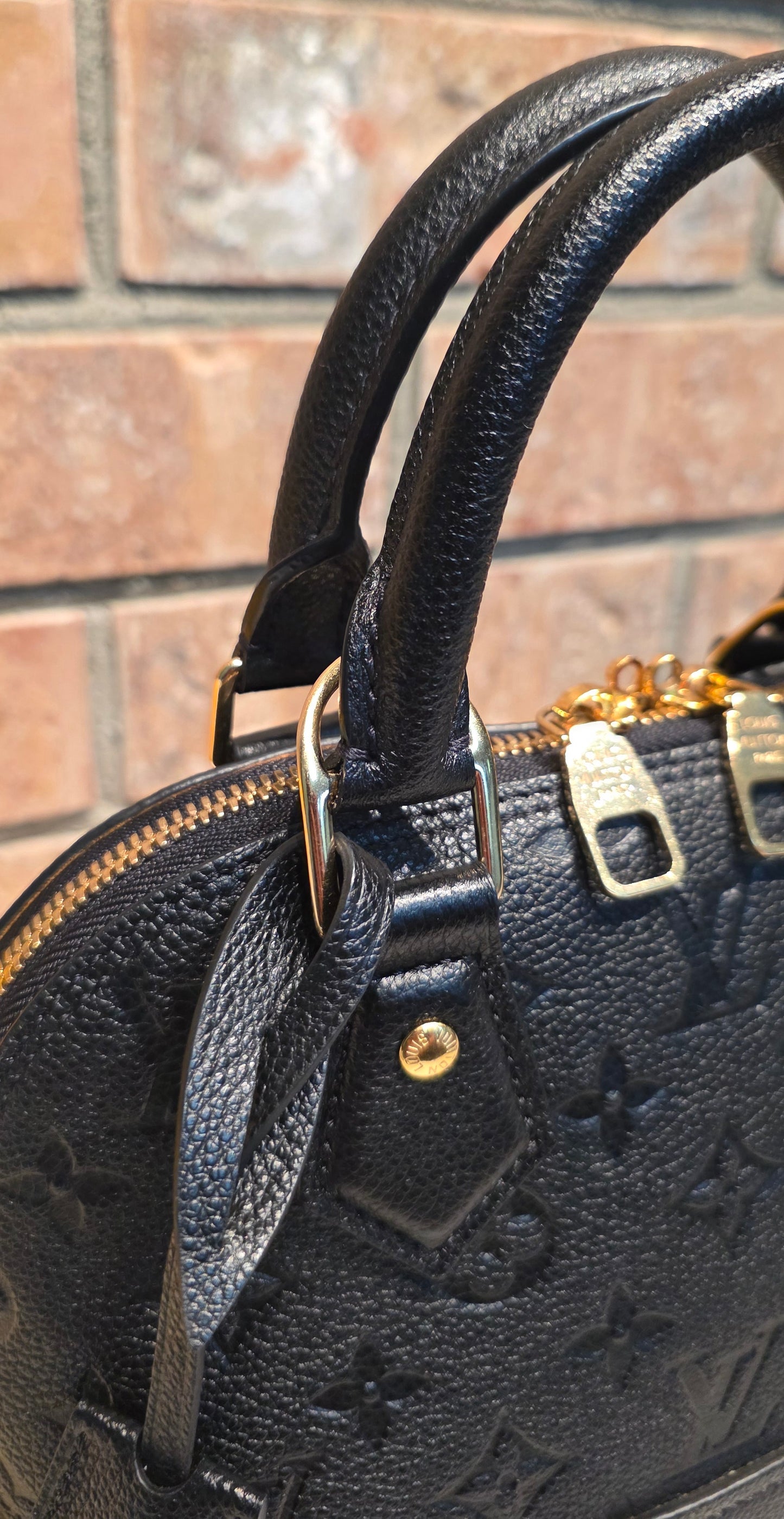 Authentic Louis Vuitton Neo Alma BB Empreinte Noir